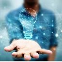 person holding a lightbulb